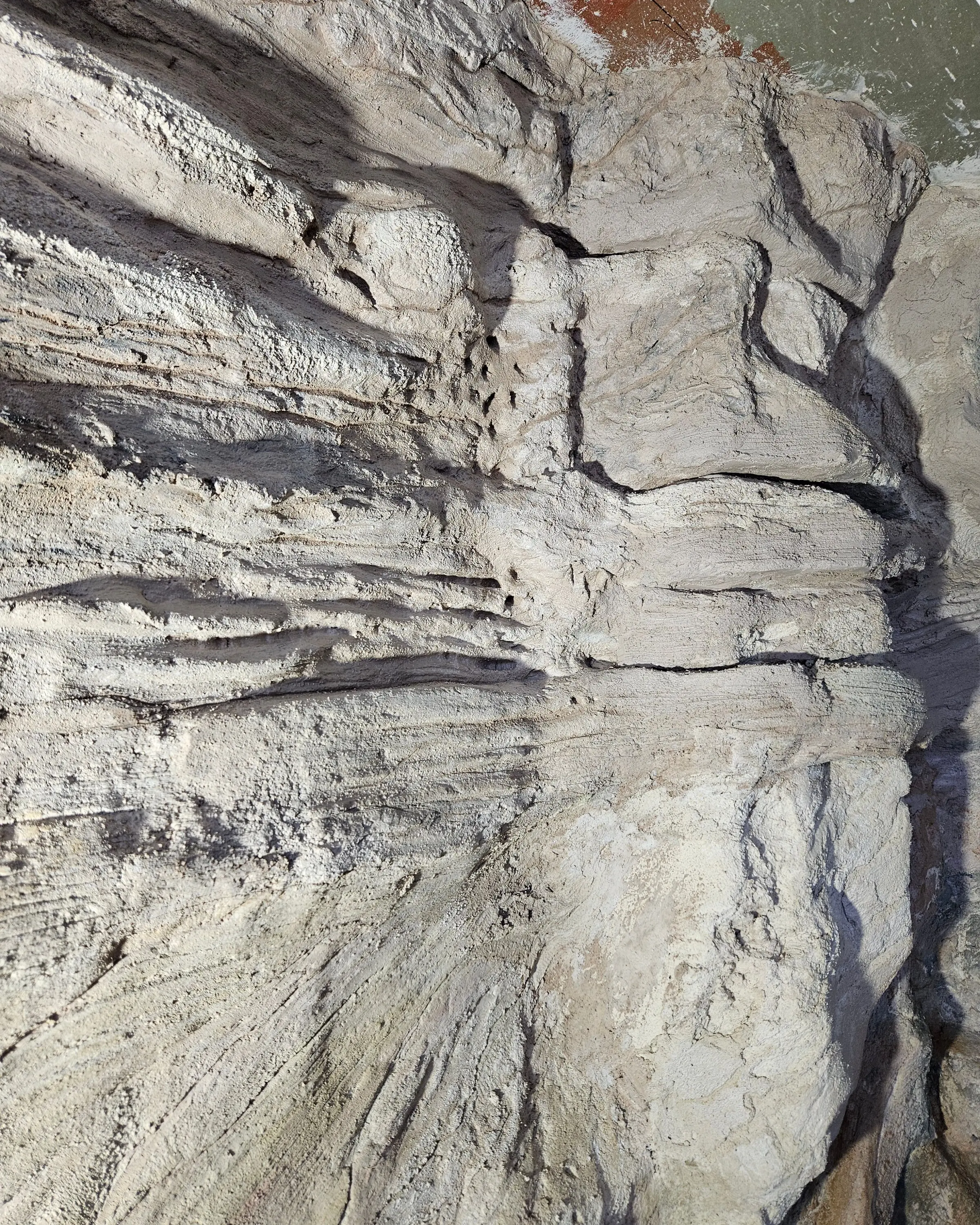 A vertical fissure worked into the unfinished surface